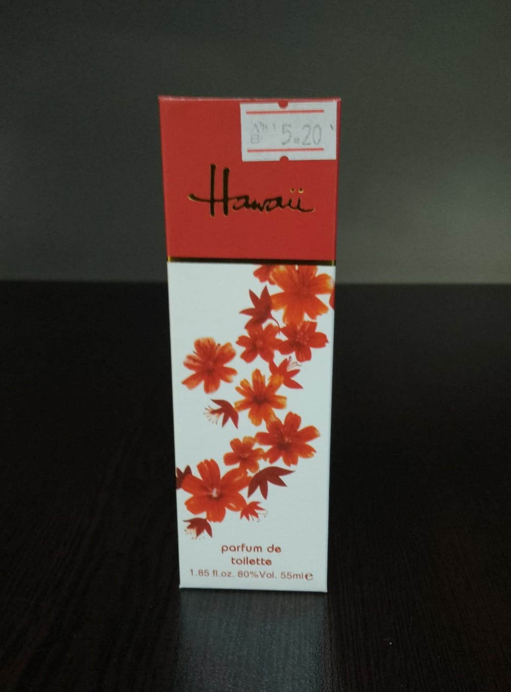 Дамски парфюм Hawaii Parfum de Toilette, 55 мл, с екзотичен дизайн и цветя в червено и оранжево върху опаковката.1